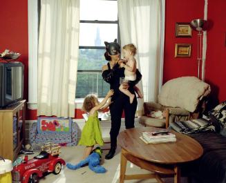 Catwoman: Minerva Valencia from Puebla, Mexico. She works as a nanny in New York, and sends home 400 dollars a week.