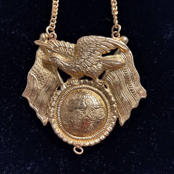 Necklace with eagles and flag