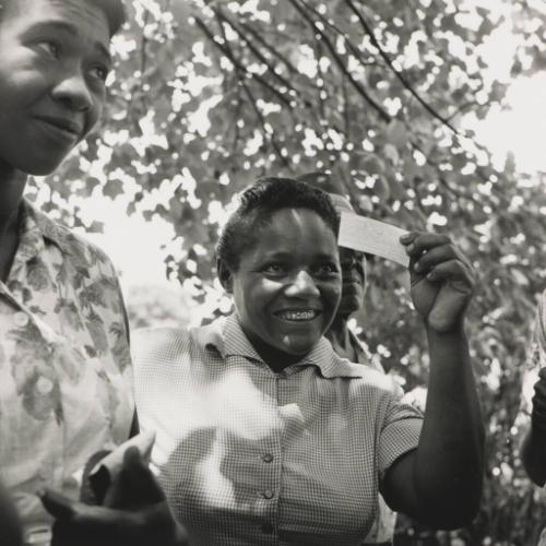 Young Woman Receives Voter Registration Card